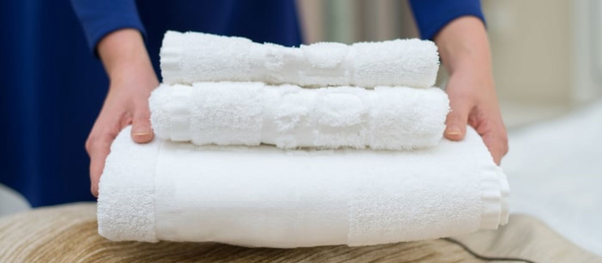 https://www.polycleanstl.com/media/kp0hivg5/woman-changing-hotel-room-towels-min.jpg?anchor=center&mode=pad&width=1920&format=webp&quality=80